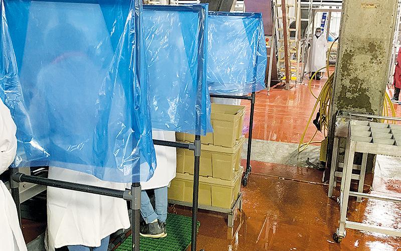 Separation stands have been placed between workers at the Fieldale Cornelia processing plant.