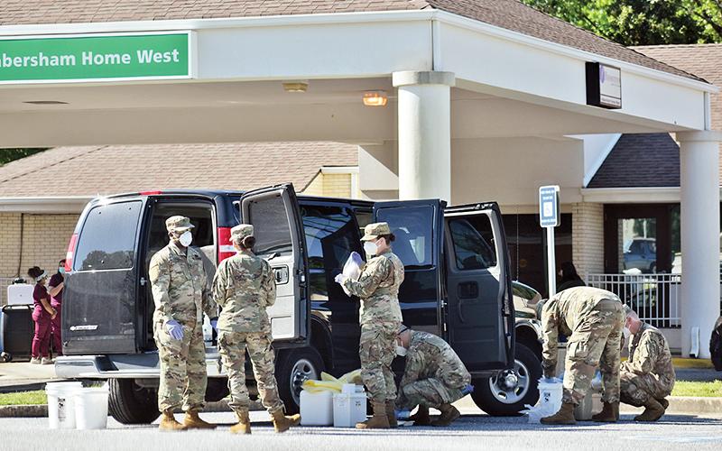 Members of the National Guard load a van up with supplies on Saturday, May 2, after conducting onsite coronavirus testing for all of the residents and staff members at Habersham Home, Habersham Medical Center’s nursing home. Photo by CODY ROGERS/Staff