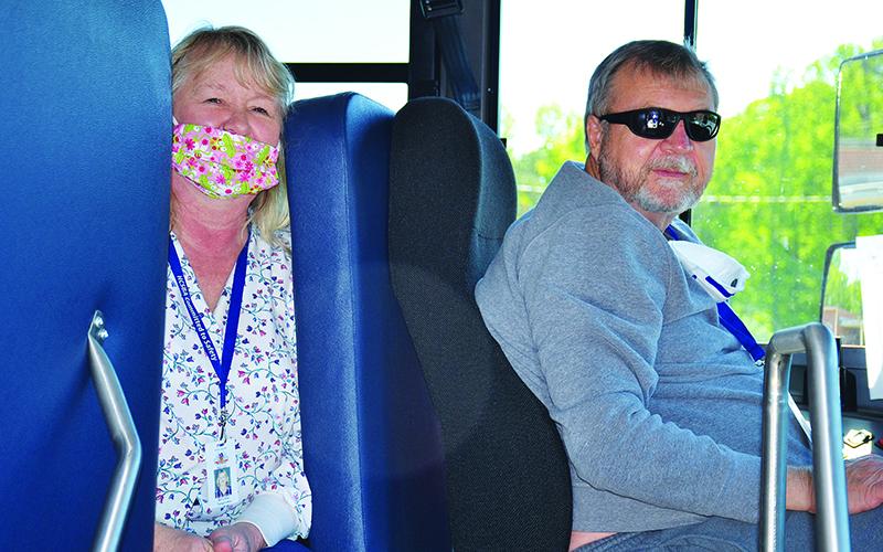 Wayne and Betty Allen drive the bus to deliver meals in the Woodville Elementary community.