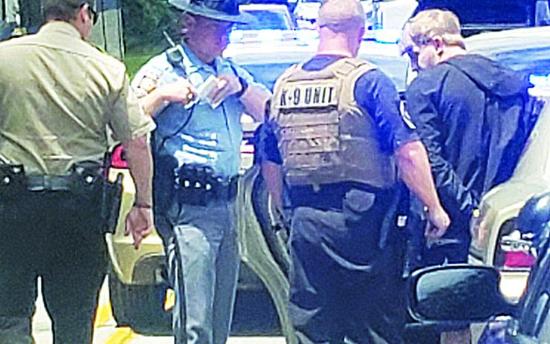 Habersham County Sheriff’s deputies arrest Blake Belback after a high-speed chase ended on Duncan Bridge Road. Photo by ALAN NESMITH