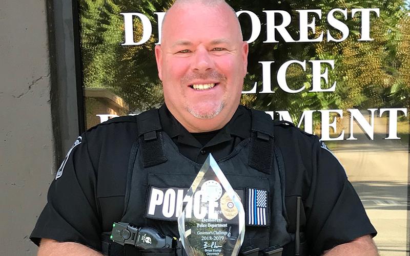 Former Demorest Police Chief Robin Krockum shows off the department’s award for best highway safety in the state in 2018-19.