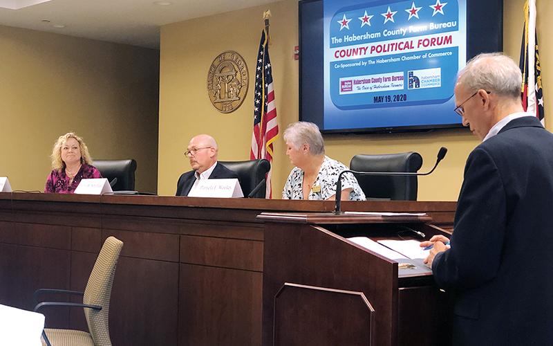 Candidates for probate judge (from left) Cindy Freeman, John Whitfield and Pam Wooley discuss the issues Tuesday night with moderator Joel Williams of WCON Radio. Photo courtesy of Farm Bureau