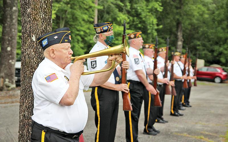 Woodrow Free plays Taps following the three-round valley at the Memorial Day ceremony.
