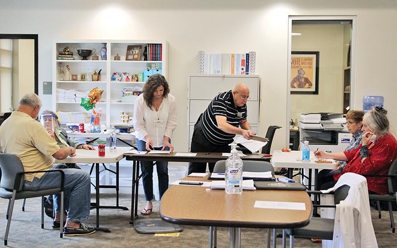 The Habersham County Board of Elections and Registration met Saturday to recount absentee ballot batches. From left are Board Vice-Chairman Paul Cordella, board member Linda Hall, Elections Supervisor Laurel Ellison, Board Chairman Carroll Jeffers, and board members Mary Lou Graden and Carolyn Steinhaus. Photo by ERIC PEREIRA