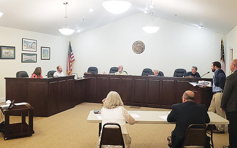 Clarkesville City Council discusses a presentation by Cornelia Mayor John Borrow on Monday night.