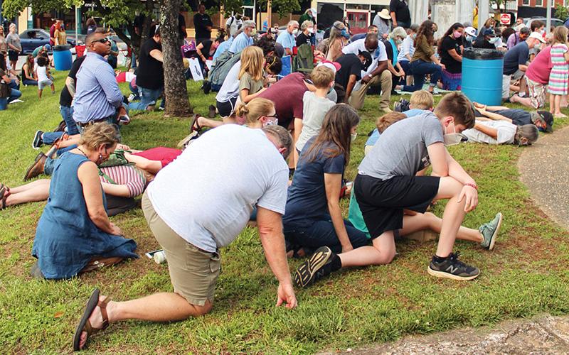The attendees took a knee or laid on the ground for 8 minutes and 46 seconds in remembrance of George Floyd. Photo by ISAIAH SMITH