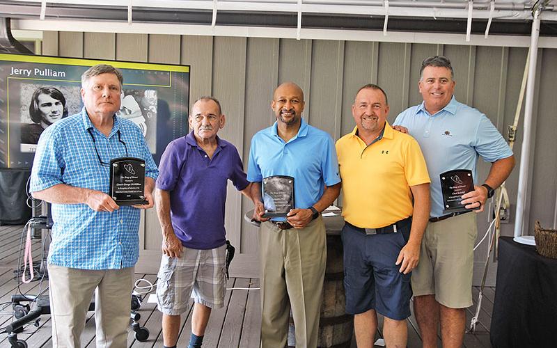 Pictured are former Coach George McMillian, and former players Jerry Pulliam, Fernandez West, Jeff Gerrin and Chad Radcliffe.
