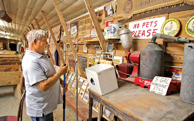 Bobby Irvin gives a tour of the chicken coop he converted in a bluegrass venue which has hosted several local and recognizable names in bluegrass music.