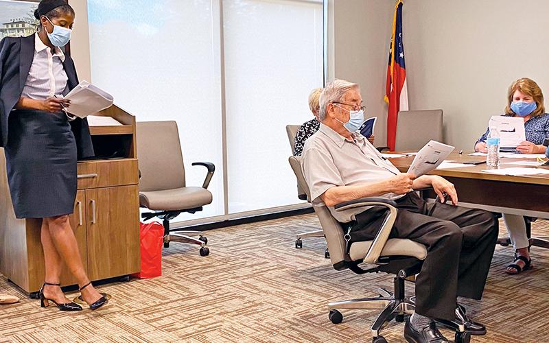 Dr. Pamela Logan (left) provides an update to the Habersham County Board of Health on Friday.