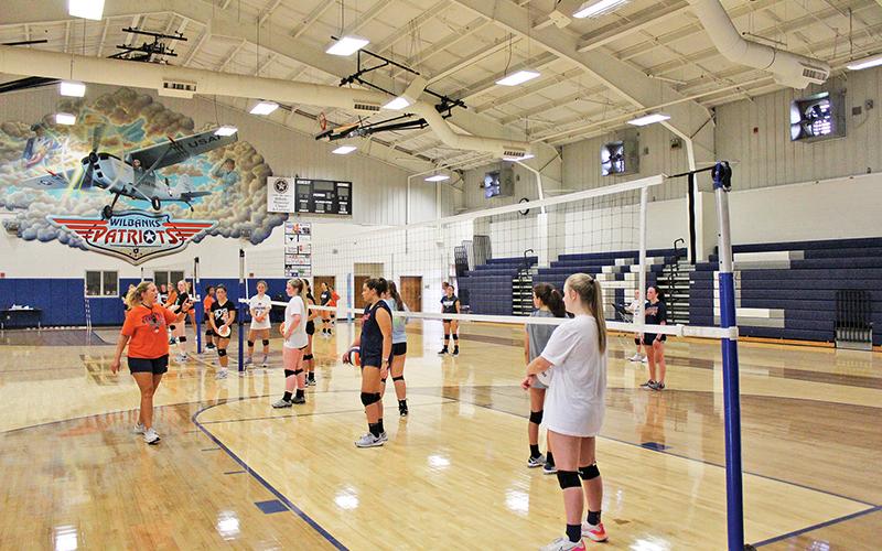 Hopeful Lady Raiders get instructions for a passing drill during the tryouts.