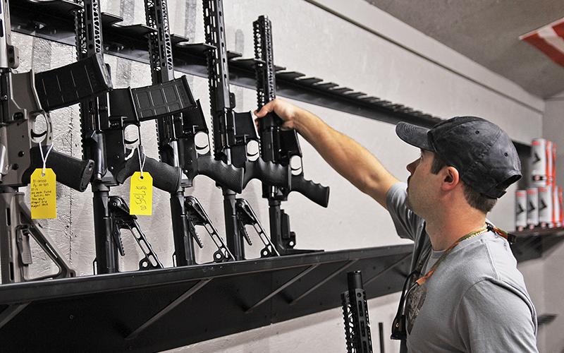 Adam Dyer, manager and business partner for Double Tap in Demorest is selling firearms and ammo at a rapid pace and trying to keep their shelves stocked.