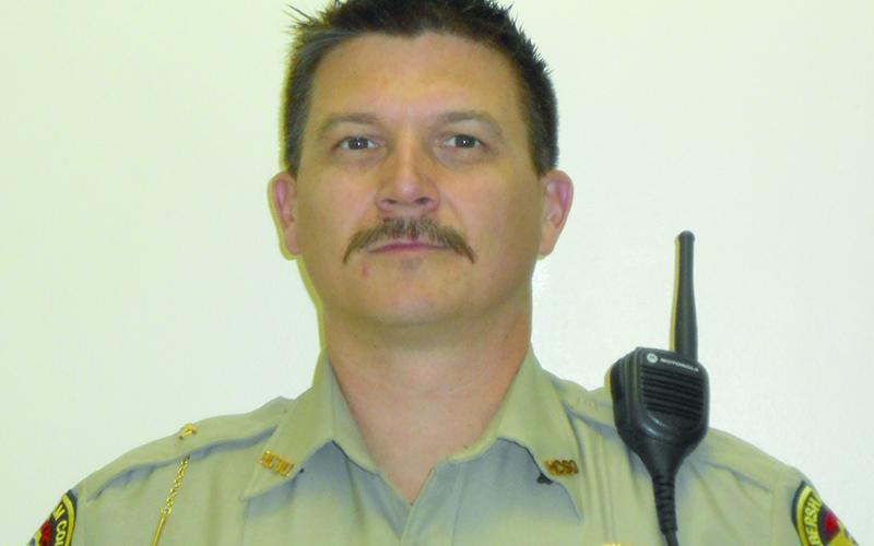Shawn Gragg currently owns an upholstery business and formerly was in law enforcement collectively for 22 years (shown in uniform in 2017).