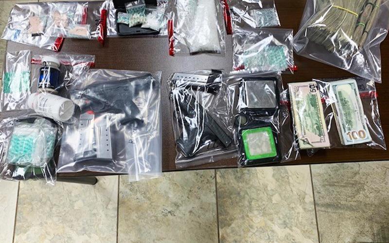 Guns and money were seized along with $8,000 worth of meth and heroin in a bust Friday by the Appalachian Regional Drug Enforcement Office.