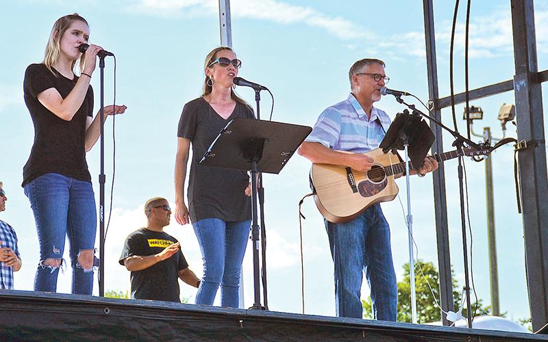 Salem Dover, Alice Dover and Alan Baker perform at Sunday's prayer meeting at Habersham Ninth Grade Academy.