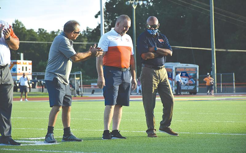 Habersham Central Ring of Honor inductee Jerry Pulliam (left) talks football with fellow defensive legends and inductees Jeff Gerrin and Fernandez West before Friday’s game. LILLIAN VAN TASSEL/Special