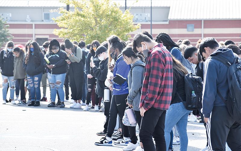 Habersham Central students stand for a moment of silence during a school walkout initiative Tuesday morning.