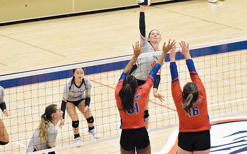 Habersham Central’s Madeline Koshuta looks to power the ball past two Jefferson blockers on Thursday night.