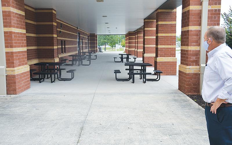 Habersham Central Principal Jonathan Stribling overlooks one of his school’s new outdoor classroom spaces, prompted by the need to social distance when schools reopen Tuesday, Sept. 8.