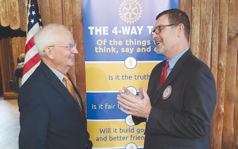 Georgia Agriculture Commissioner Gary Black (left) speaks with Philip Smith, President of the Rotary Club of Habersham County. ALAN NESMITH/Staff