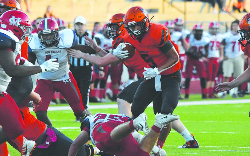 Habersham Central’s Jackson Clouatre jukes a defender on his way to a big gain on Friday night. Photo by LILLIAN VAN TASSEL