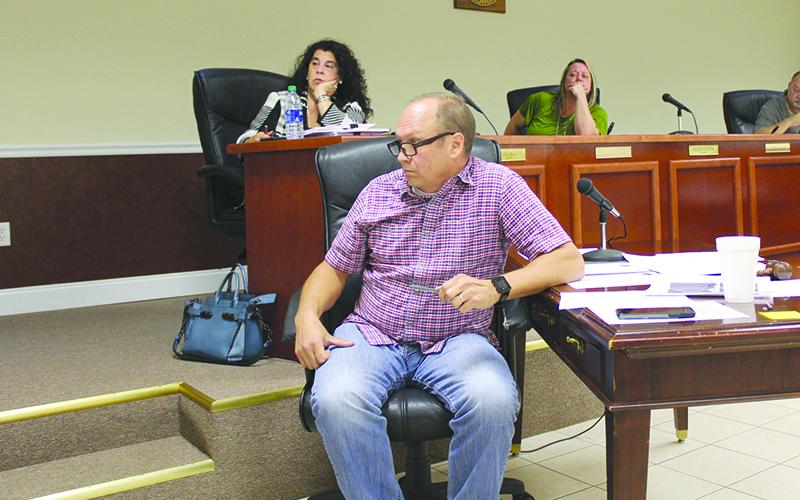 Baldwin Mayor Joe Elam listens to comments at Monday’s meeting of the city council.