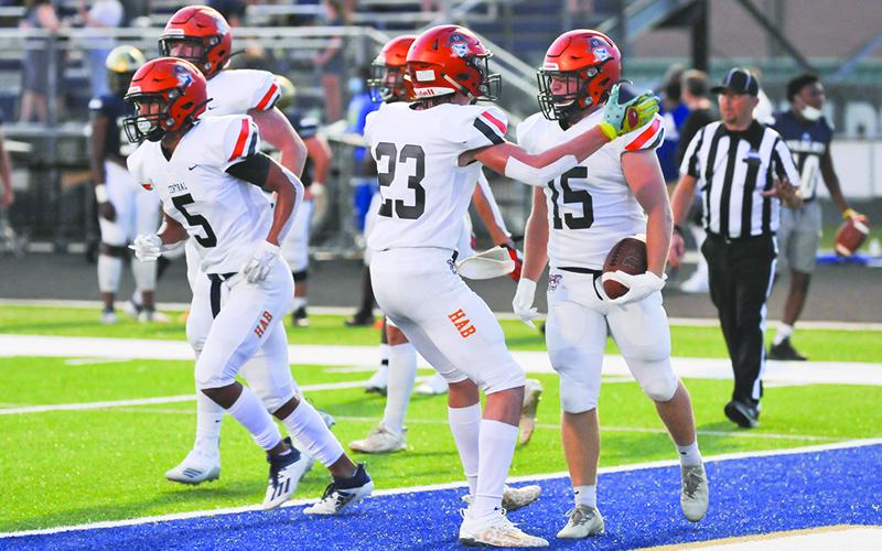 Tedder celebrates the first Raider touchdown of the night earlier, showing his versatility. TOM ASKEW/Special