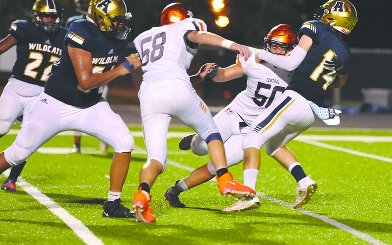 Habersham Central’s Tanner Wade (50) and Jonathan Adams (58) put pressure on Apalachee quarterback Todd Jones during a win on Sept. 11. TOM ASKEW/Special