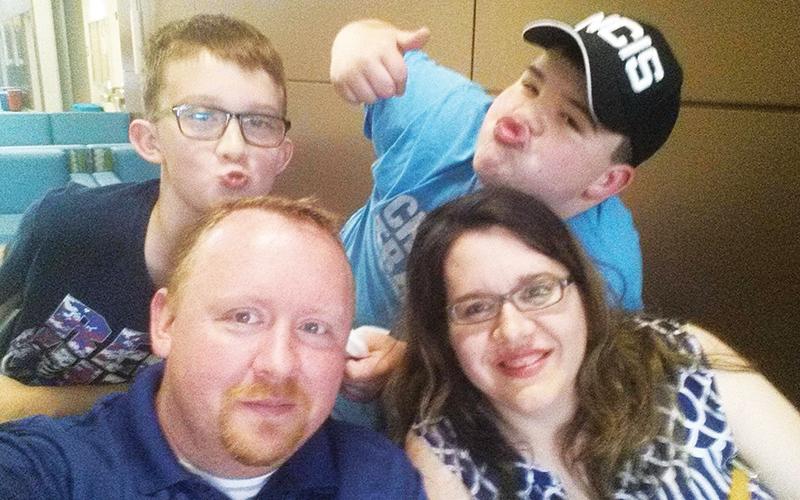 Shawn Weldy (bottom left) used lessons learned young to build a successful career and family, along with wife Laura and sons Tucker and Hayden.