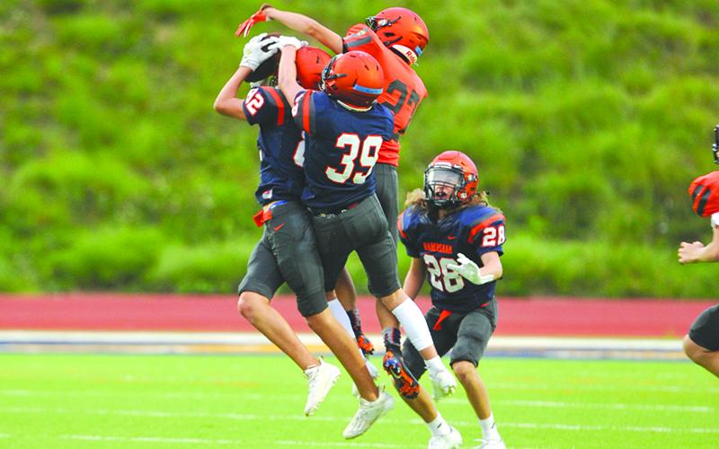 Jarrod White intercepts a pass during the scrimmage.