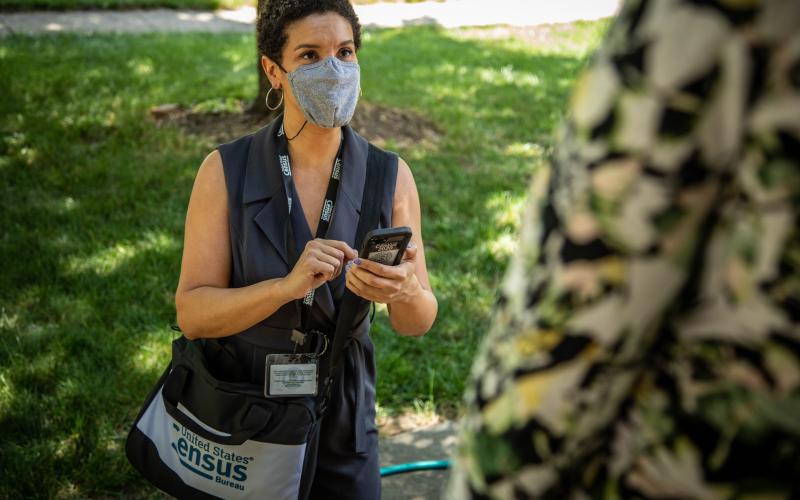 A U.S. Census worker conducts a nonresponse follow up.