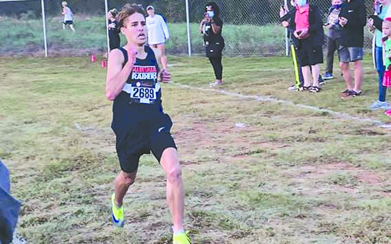 Habersham Central’s Andrew Kivett overcame an injury to win the regional cross country meet.