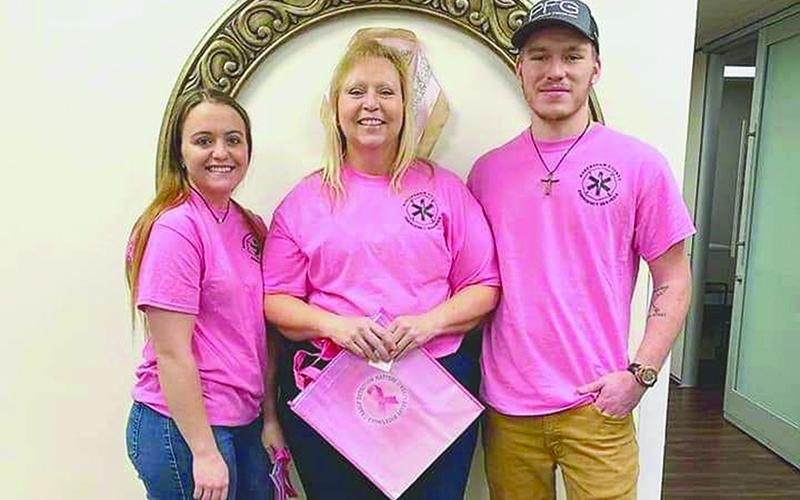 Angela Turk poses with her daughter CJ and son Tristan.