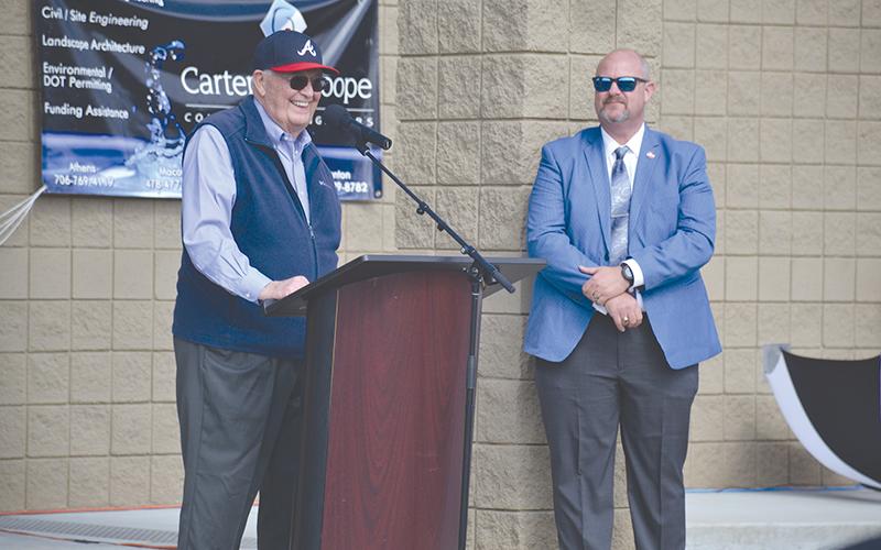 Former Georgia Sen. John Foster (left) smiles after Cornelia dedicated its new water plant to him during a ceremony Monday. Cornelia City Manager Dee Anderson made the introduction.