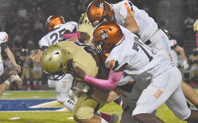 Habersham Central’s Alex Aaron leads a tackle of a Dacula ballcarrier during Friday’s game. LILLIAN VANTASSEL/Special