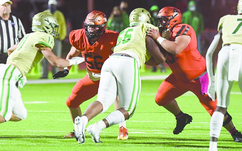 The Raiders’ running game revolves around three good backs behind a strong offensive line that includes Butch Cassidy (56) and Ethan Tomlin (53). TOM ASKEW/Staff