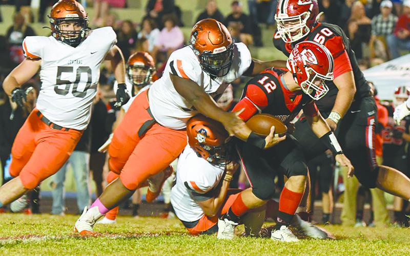 Habersham Central’s Avian Shields and Patrick Tedder bring down Stephens County’s Ben Stowe during Friday night’s game. TOM ASKEW/Special