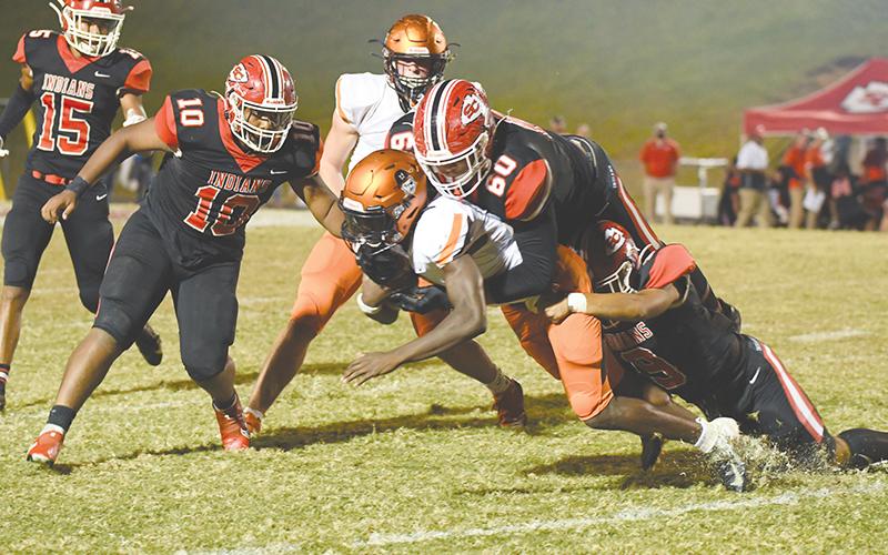 Habersham Central’s Joshua Pickett is brought down after a run by Stephens County’s D.J. Hampton (60) and Bryson Trimier (9) during Friday’s game. TOM ASKEW/Special