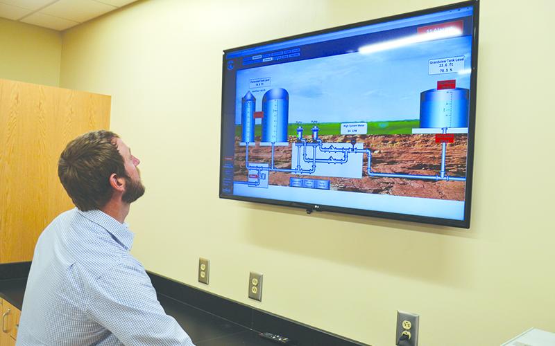 Carter &amp; Sloope engineer Jeremy Pirkle shows off the plant's automation systems.