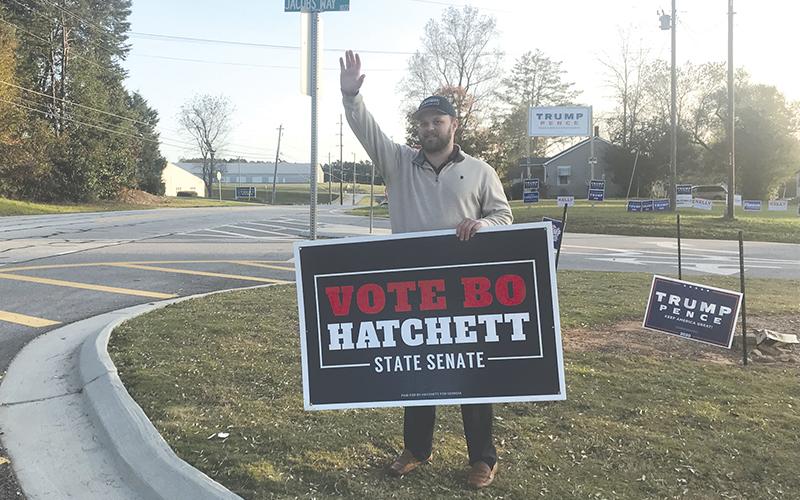 Georgia Senator-elect Bo Hatchett waves to cars Tuesday morning on Louise Street and Jacob’s Way near the Ruby Fulbright Aquatic Center.