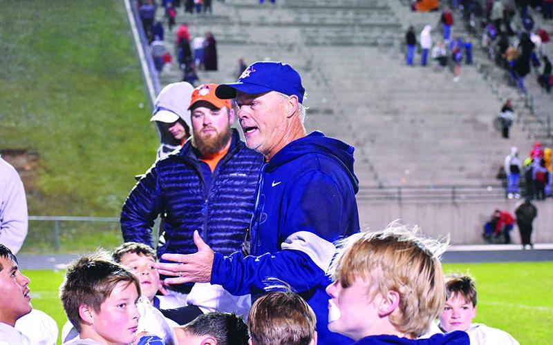 Habersham middle school football coach Mark Ausburn talks with his team after winning the league championship on Nov. 2.