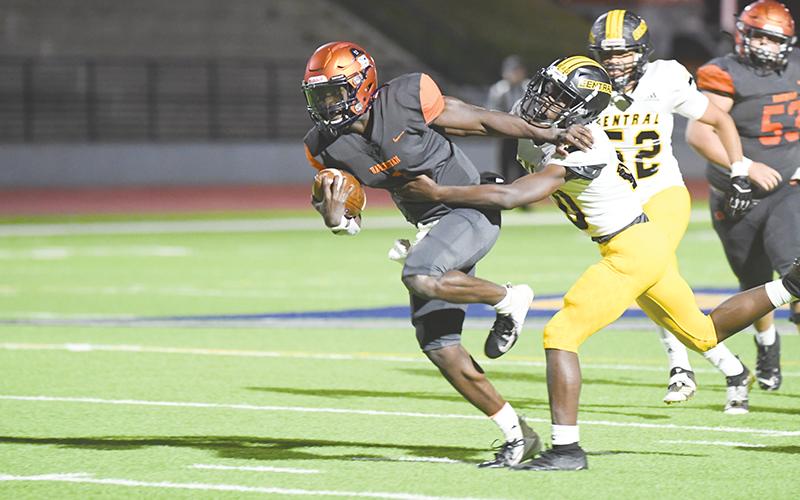 Habersham Central’s Joshua Pickett does a Heisman stiffarm to bypass a Central  Gwinnett tackler on Tuesday night. TOM ASKEW/Special
