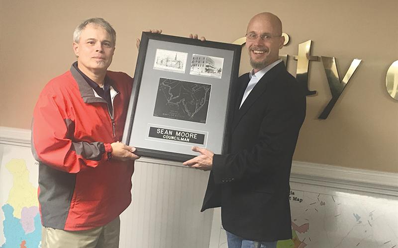 Demorest Mayor Rick Austin (right) presented departing Councilman Sean Moore with a plaque commemorating his service at Tuesday’s City Council meeting.