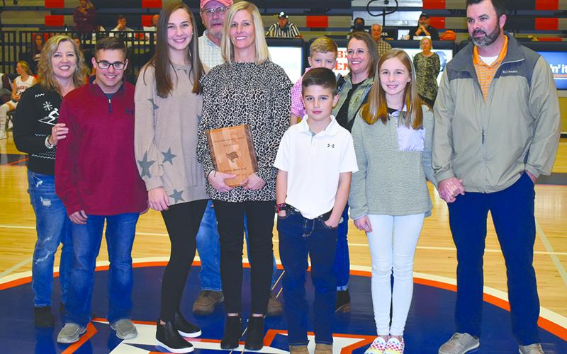Christy Keef was joined Friday night during her induction by (front row, from left) Tammy Harris; children Carlin Fricks, Camryn Fricks, Kyler Keef and Katie Keef; and husband Dan Keef. In back are (from left) Alex Harris, Garrison Stamey and Valerie Stamey.