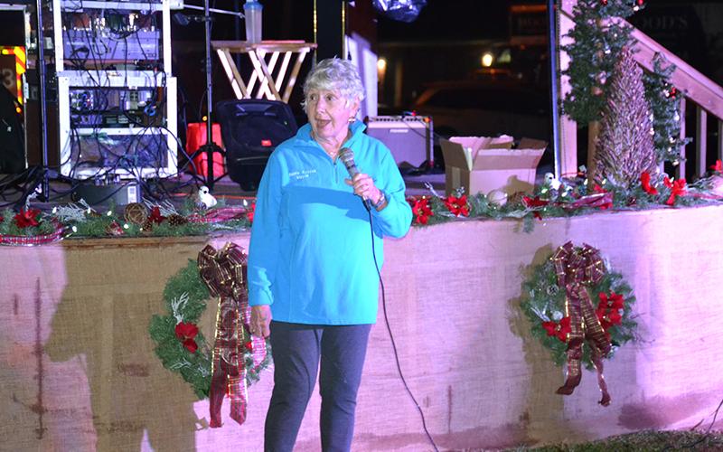 Clarkesville Barrie Aycock prepares to invite children up to light the city Christmas tree.
