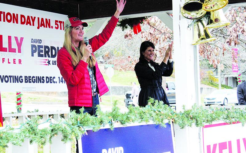 U.S. Sen. Kelly Loeffler waves acknowledges applause from a crowd of 250-plus on the second stop of her statewide firewall tour Sunday in Demorest. Loeffler was joined by former U.N. Ambassador Nikki Haley (right) for each of her stops throughout the day.