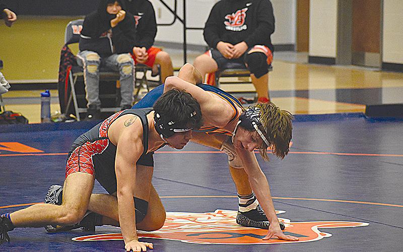 Habersham Central’s Ethan Watson (right) locks in a hold Saturday against Winder-Barrow.