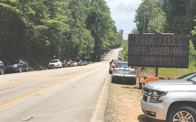Heavy crowds at Panther Creek Park often cause scenes like this, with visitors parking alongside the edge of the road which can create safety hazards.