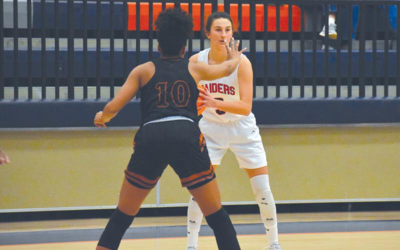 Addie Penick looks to make a play in a recent Lady Raider victory over Lanier. HCHS fell Tuesday night to region-leader Buford 49-36 in a contest that came down to the fourth quarter.