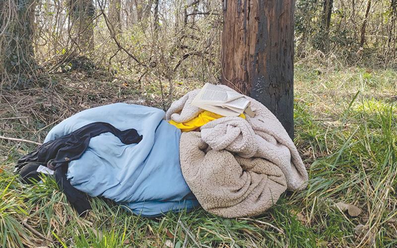 Blankets were freshly stacked next to this power pole in Cornelia Tuesday by someone needing them for shelter.