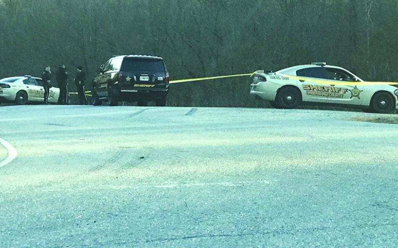 Habersham County Sheriff’s deputies gather near the White County line on Highway 115 Monday afternoon to investigate a shooting.